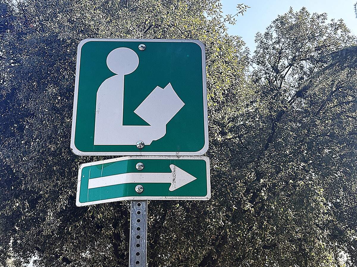 A sign points the way outside the Fresno County Central Library on Mariposa Street in downtown Fresno on Thursday, Feb. 5, 2026.